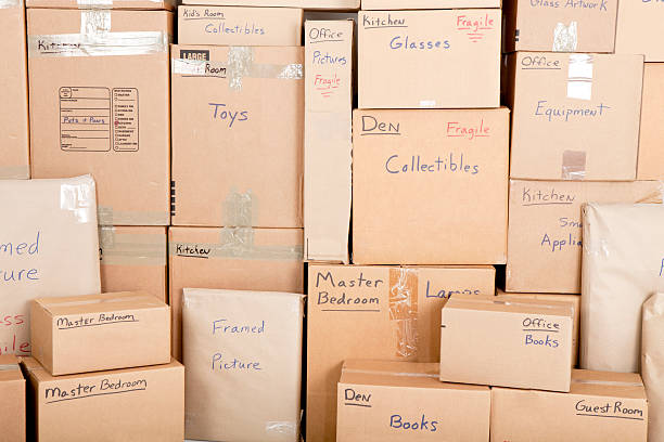 Neatly stacked moving boxes ready for professional unpacking and organization