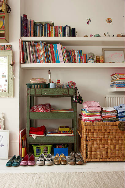 Colorful organized kids room with tidy toy storage and bookshelves